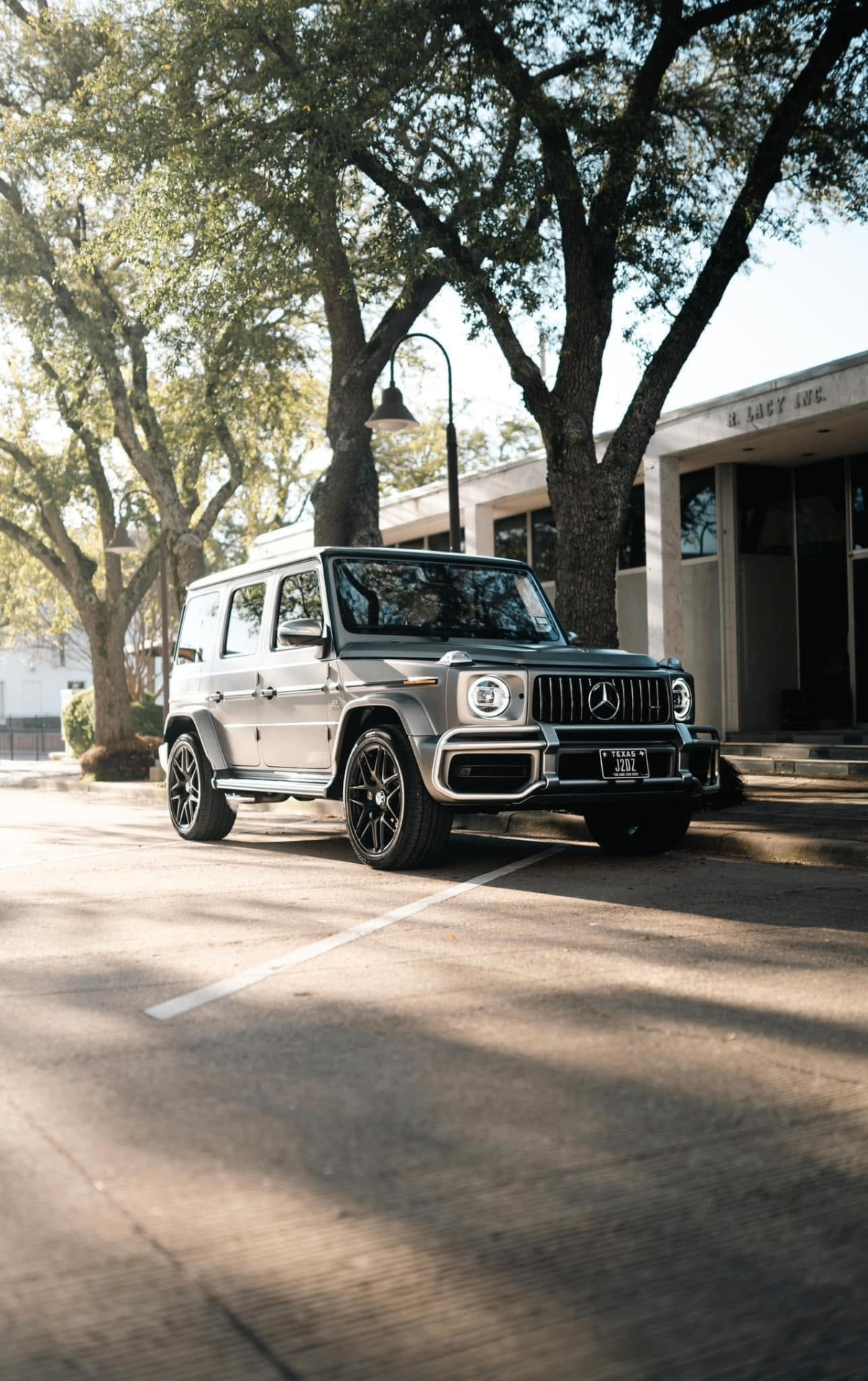 car detailing in Longview by SE Auto Solutions — Silver Mercedes-Benz G-Wagon downtown — premium exterior finish in natural light, Longview
