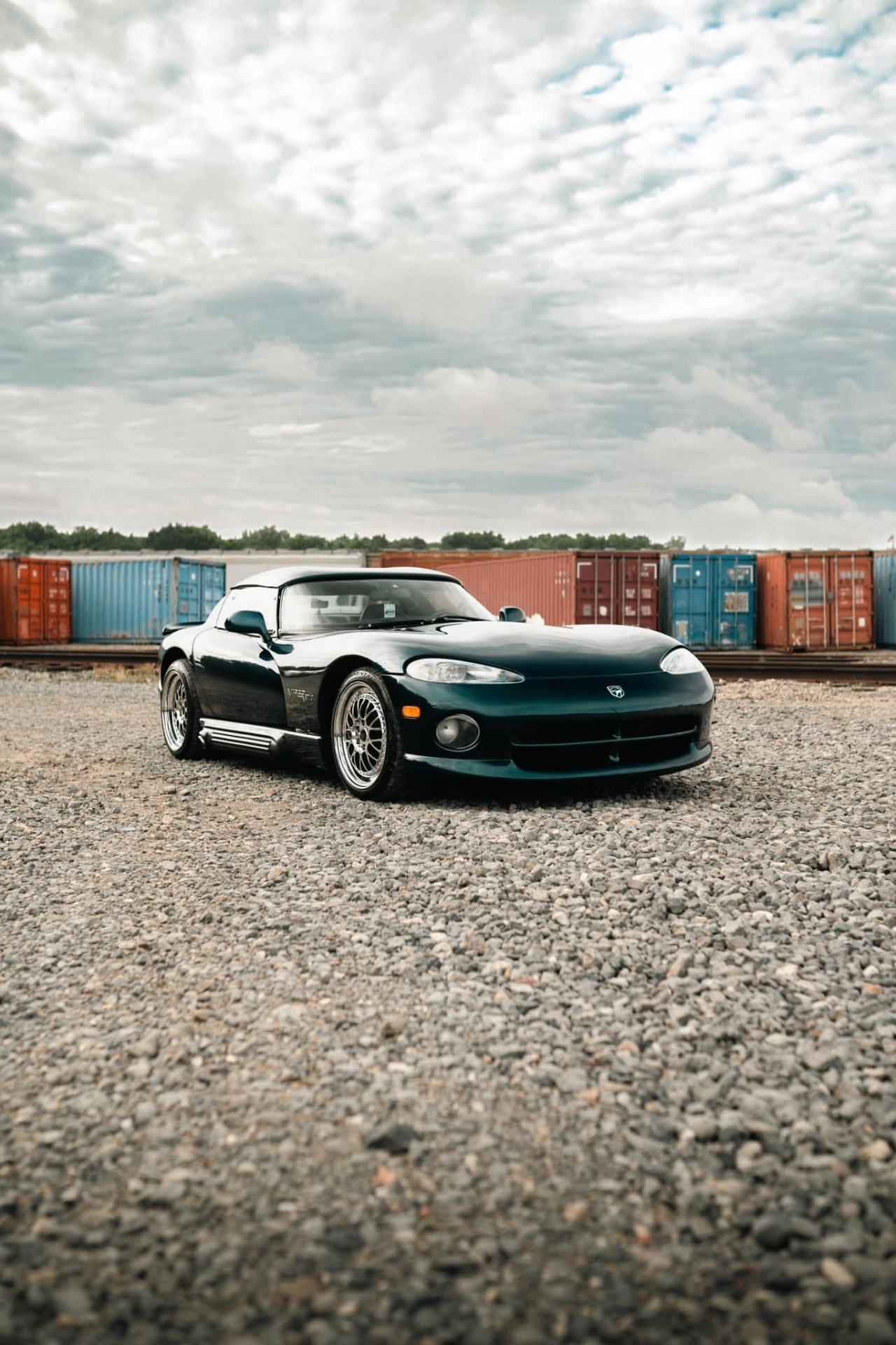 car detailing in Longview by SE Auto Solutions — Black Dodge Viper roadster — deep-gloss exterior finish outdoors, Longview