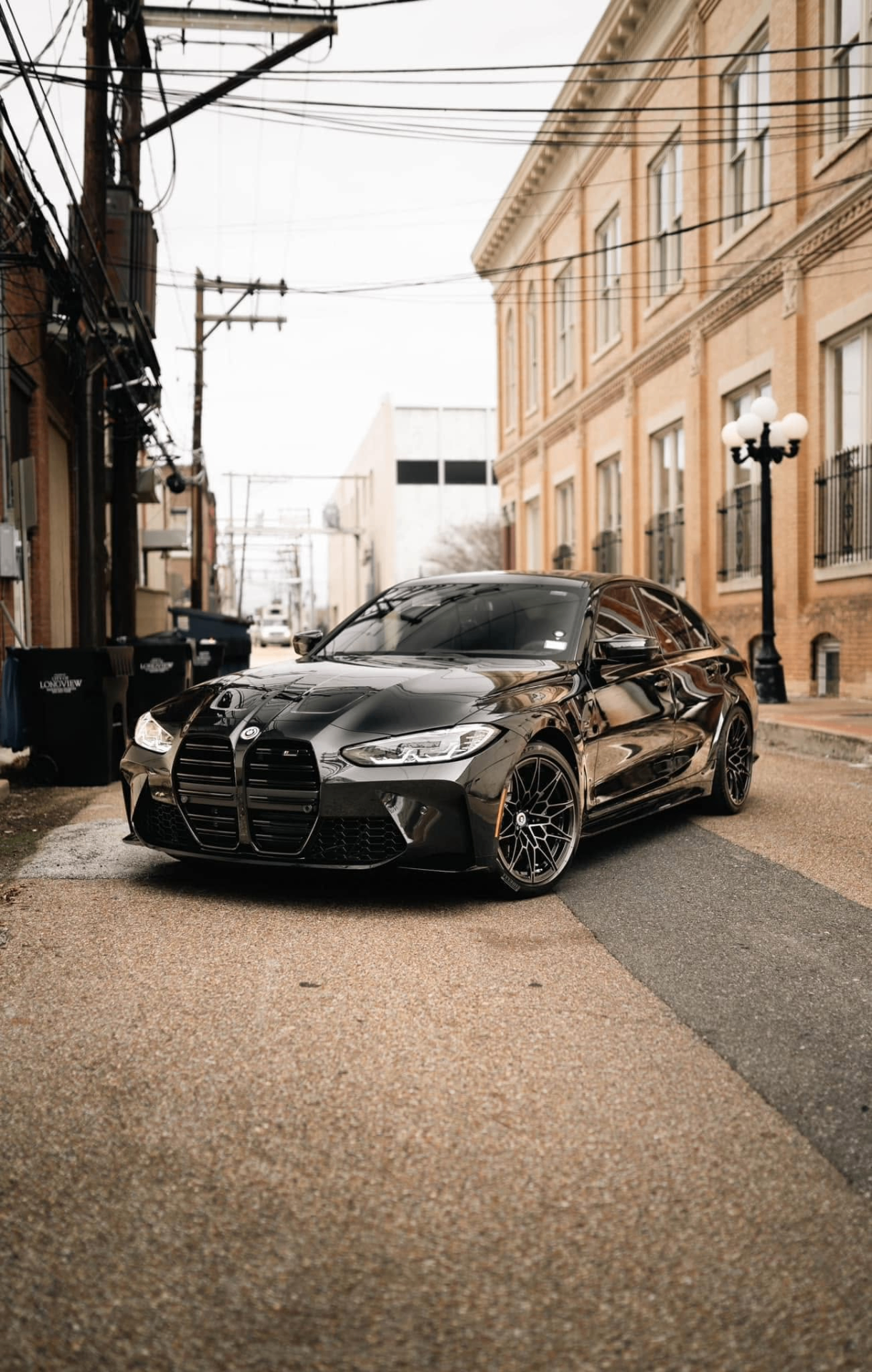car detailing in Longview by SE Auto Solutions — Black BMW M3 Competition downtown — deep-gloss show finish, Longview