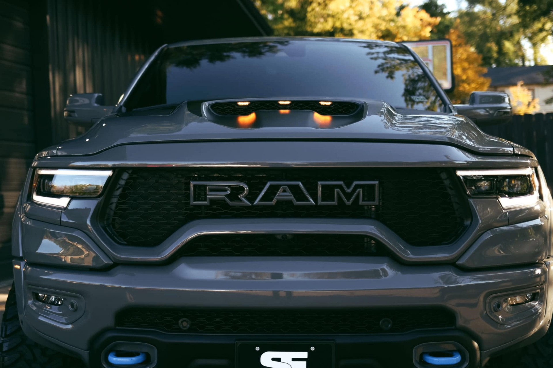 car detailing in Longview by SE Auto Solutions — Gray RAM TRX front grille and hood detail — sharp finish, Longview